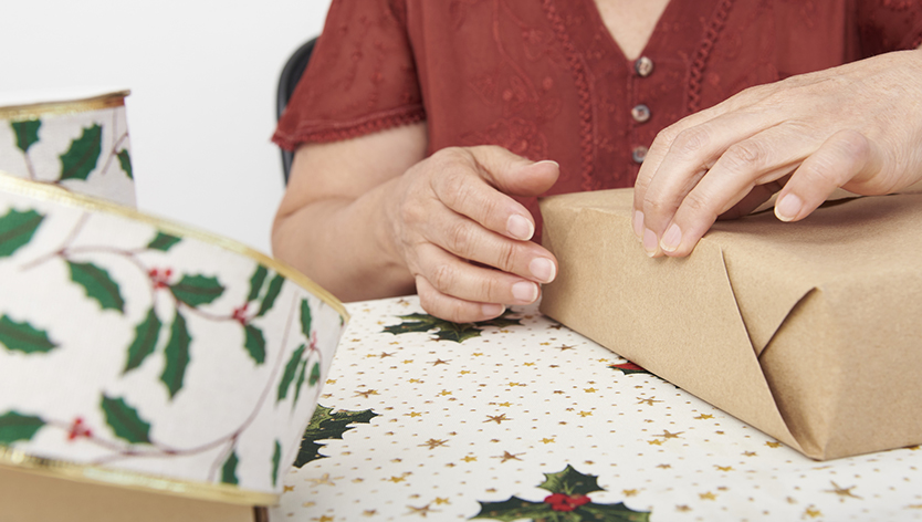 woman wrapping a parcel