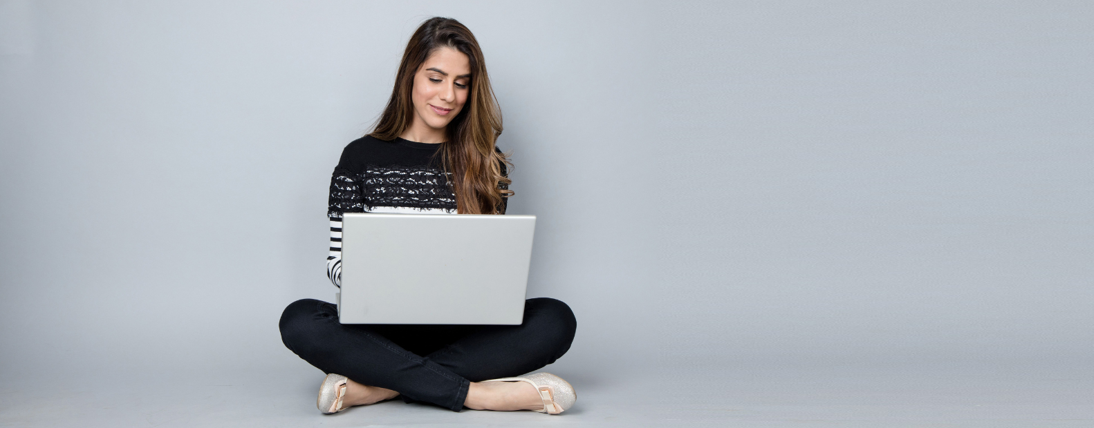 Women sitting using laptop