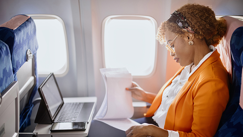 Woman doing work on a plane
